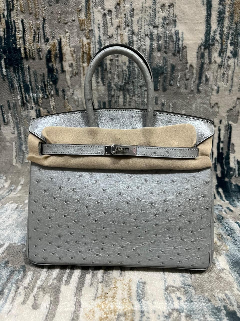 Herm**s ostrich bag.