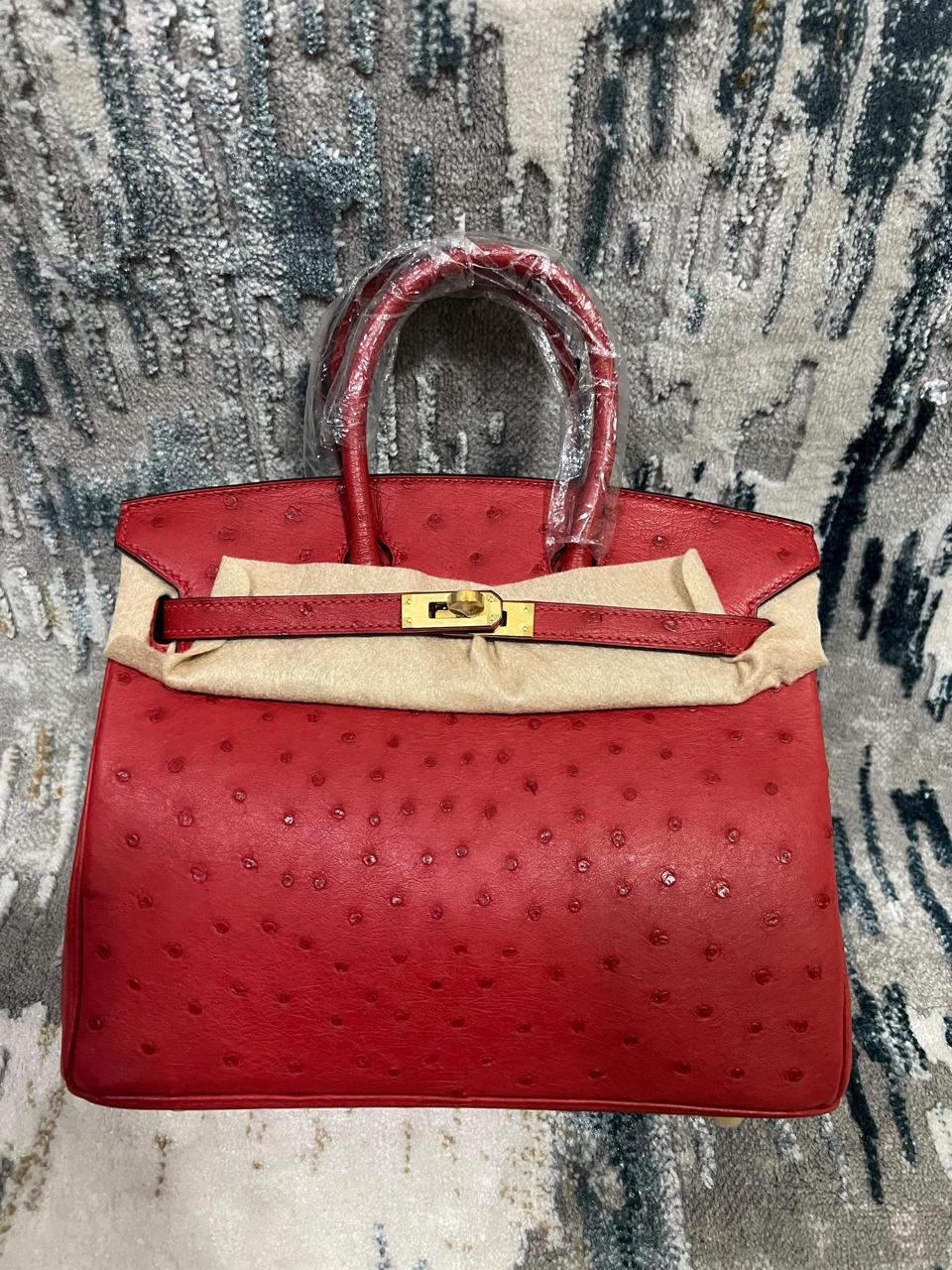 Herm**s ostrich bag.