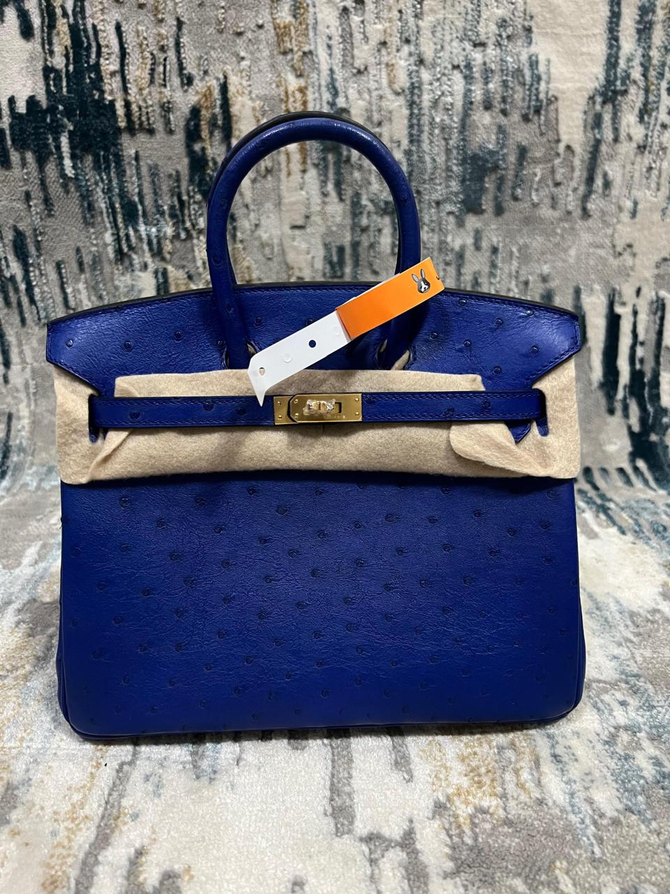 Herm**s ostrich bag.