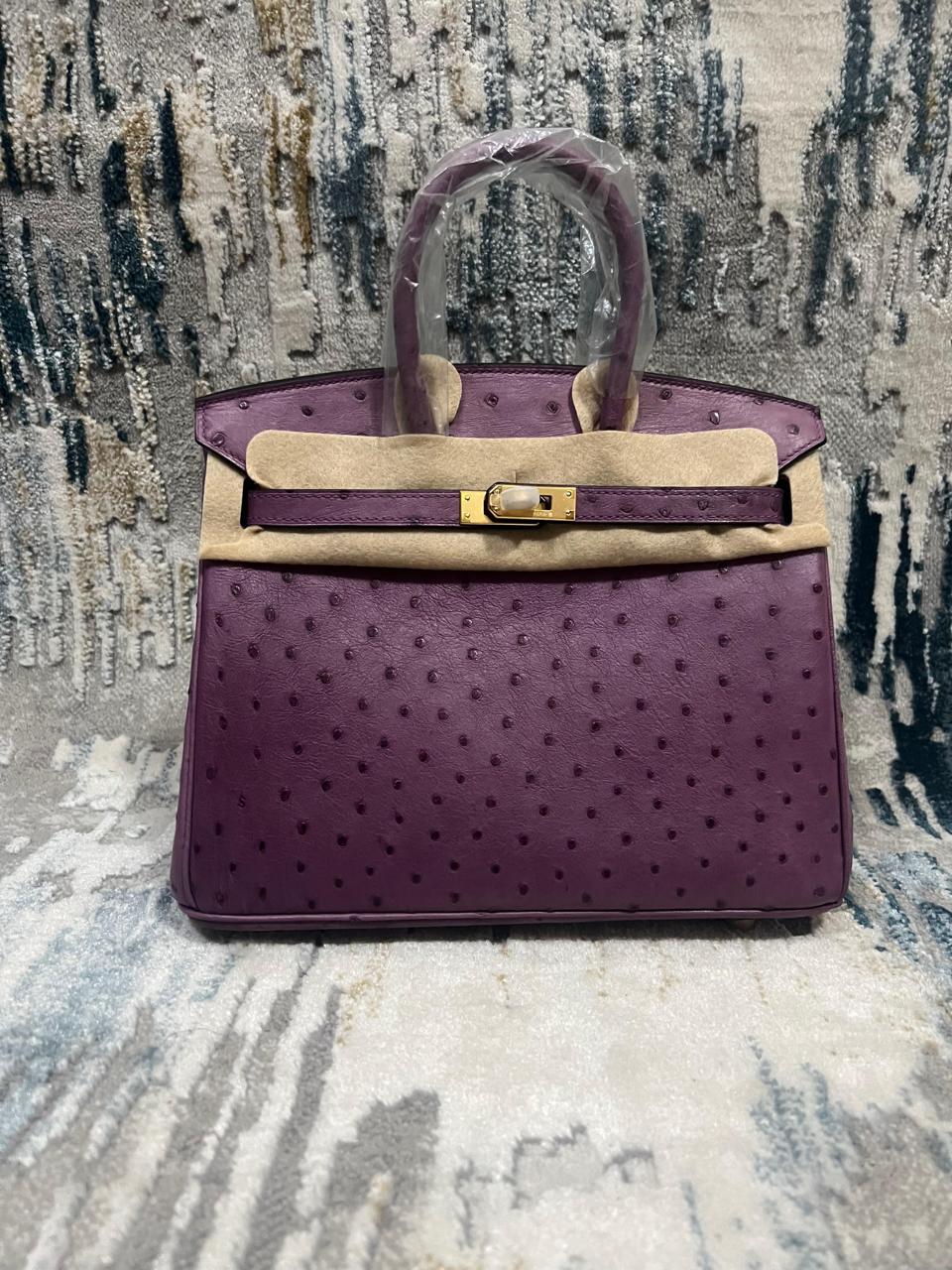 Herm**s ostrich bag.