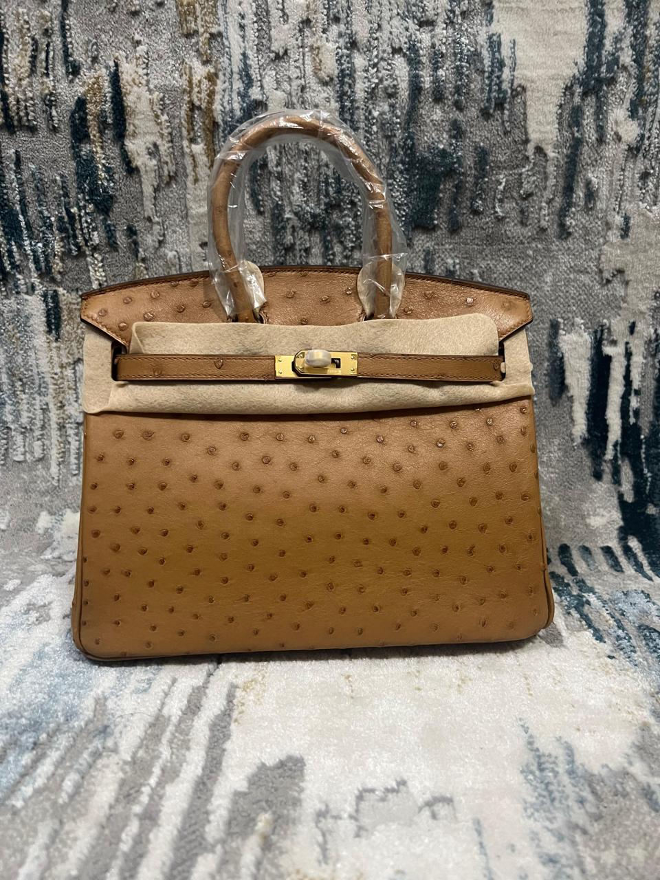 Herm**s ostrich bag.