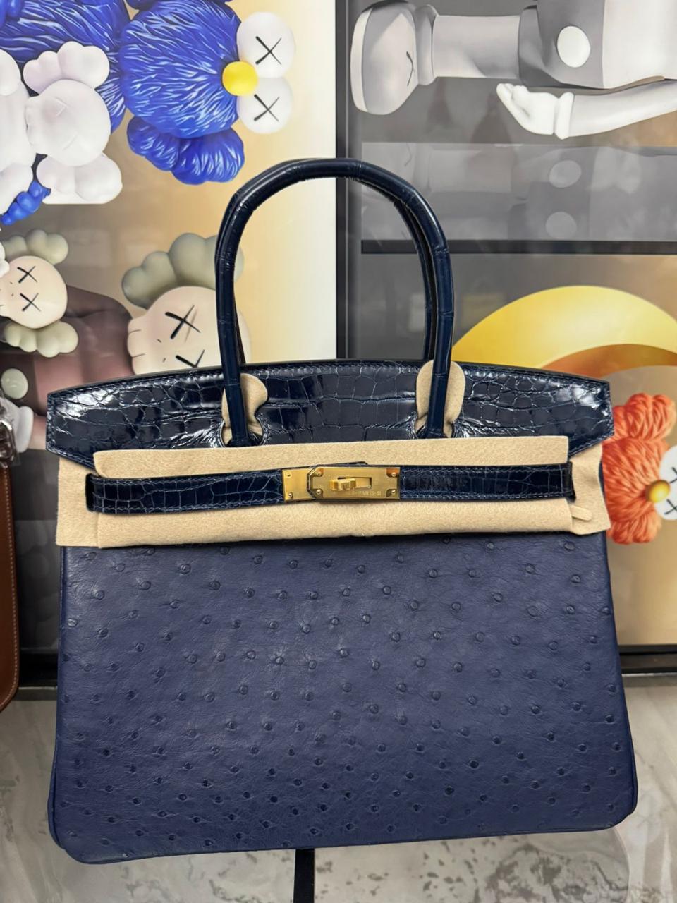 Herm**s ostrich bag.