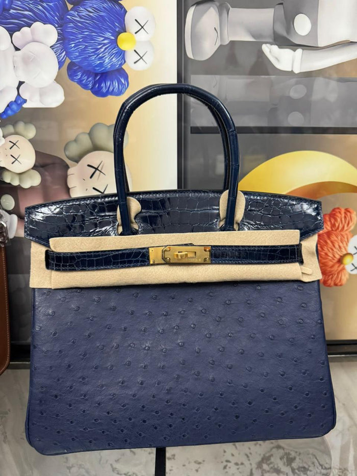 Herm**s ostrich bag.