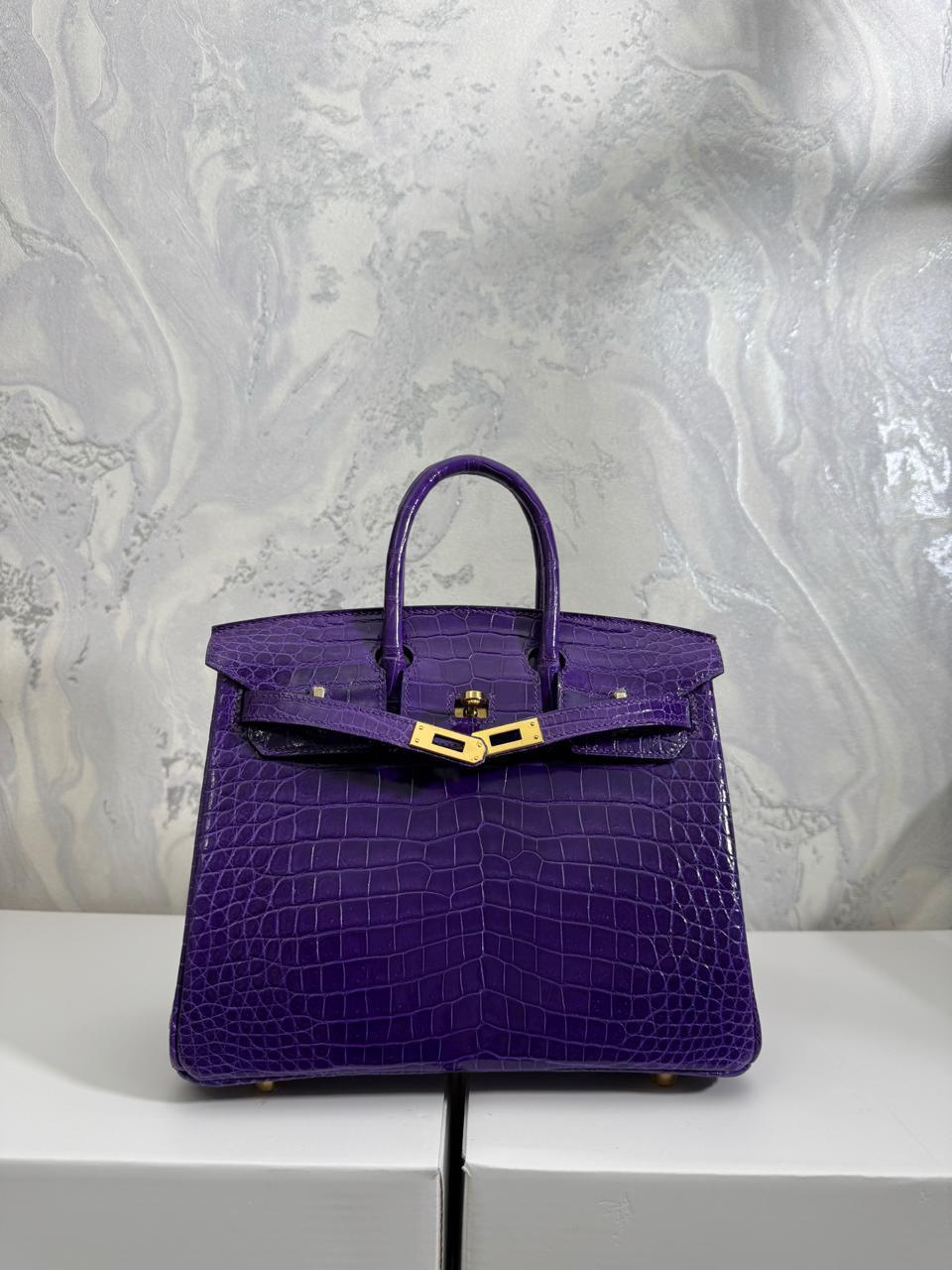 Herm**s crocodile bags.