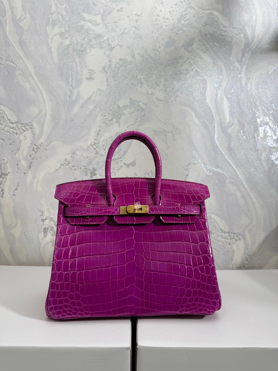 Herm**s crocodile bags.