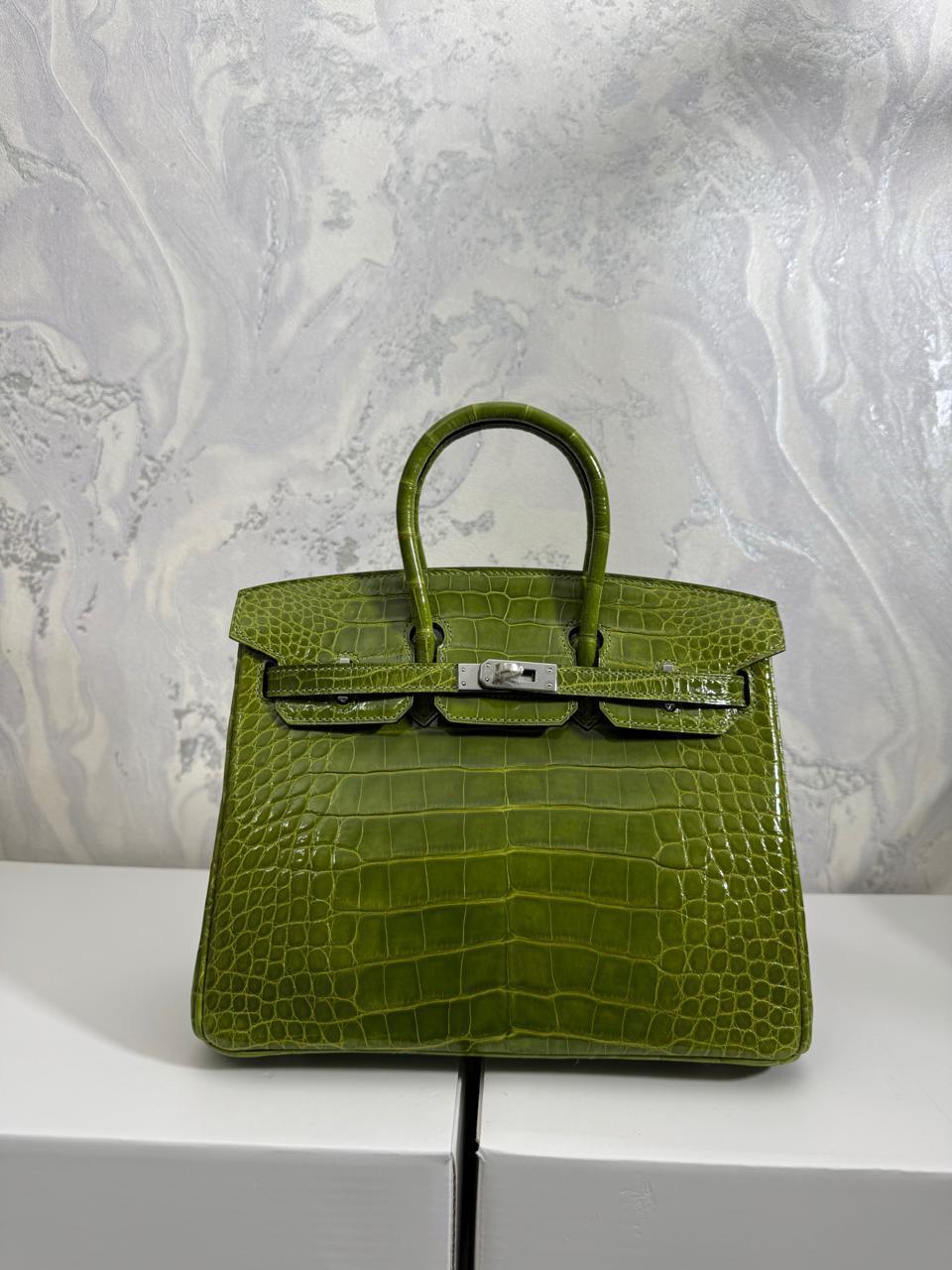 Herm**s crocodile bags.