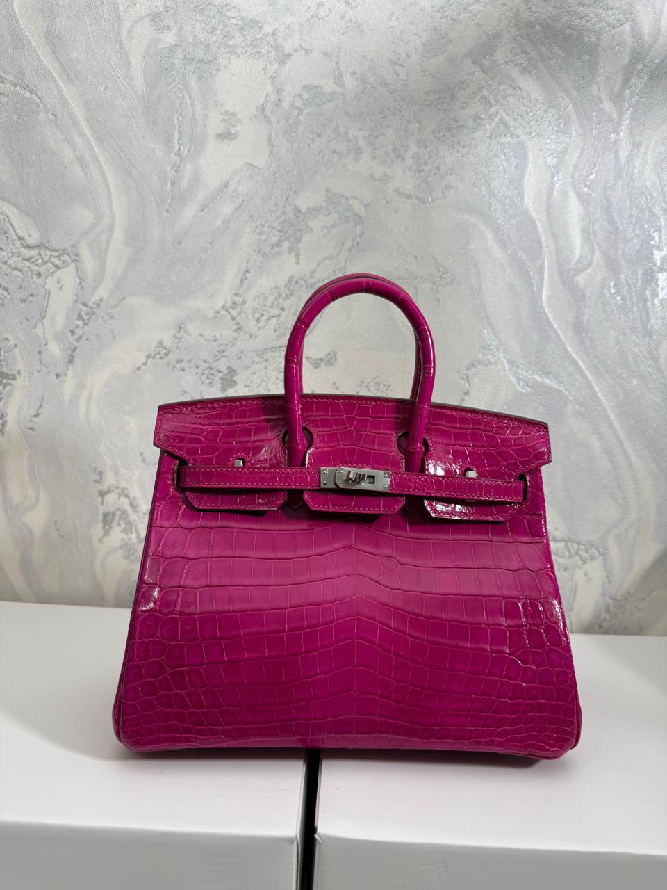 Herm**s crocodile bags.