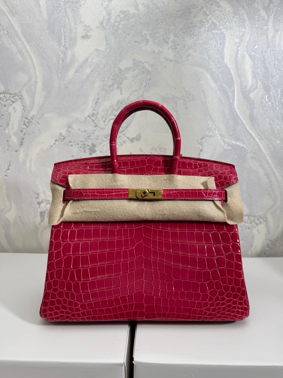 Herm**s crocodile bags.