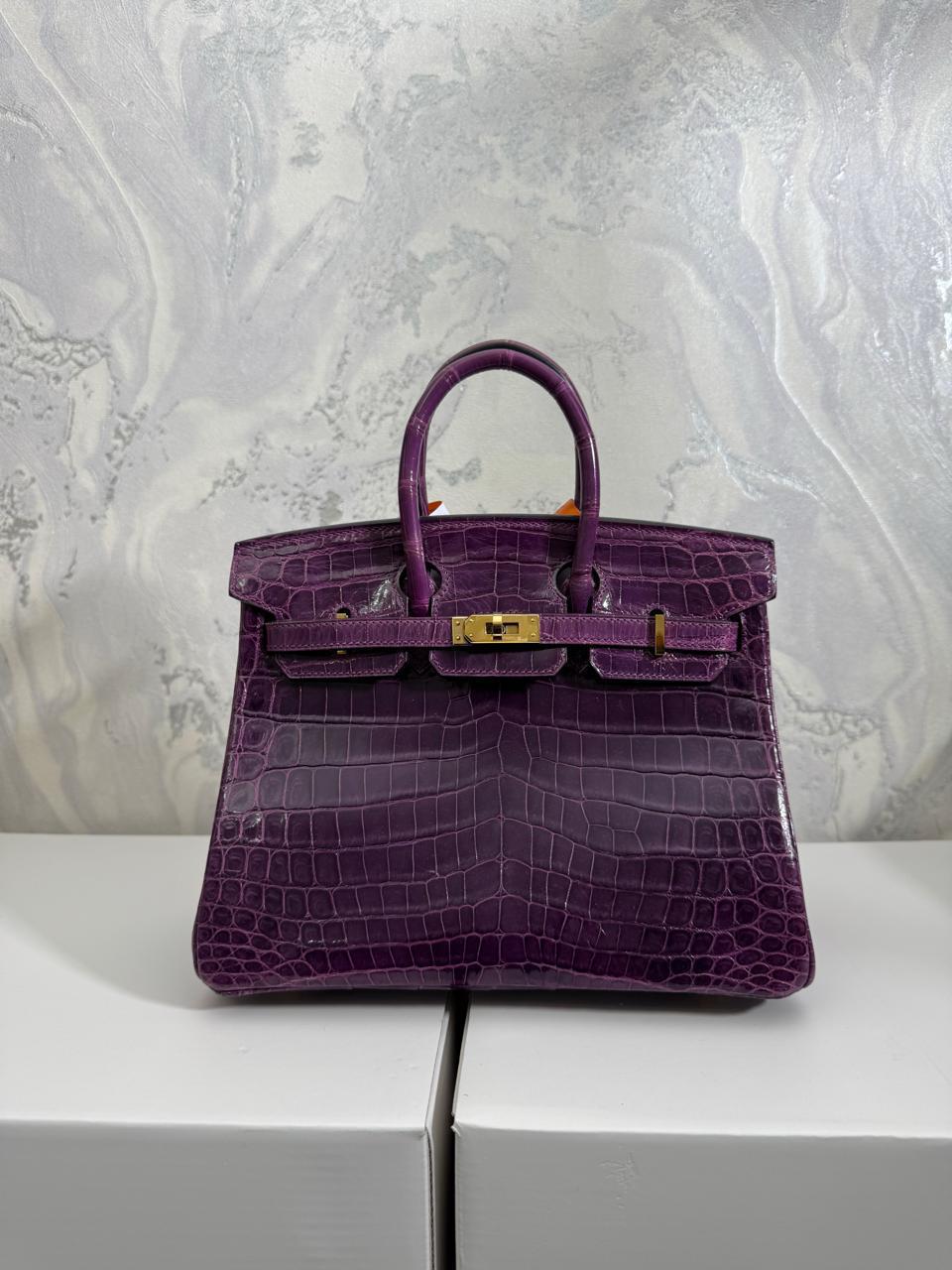 Herm**s crocodile bags.