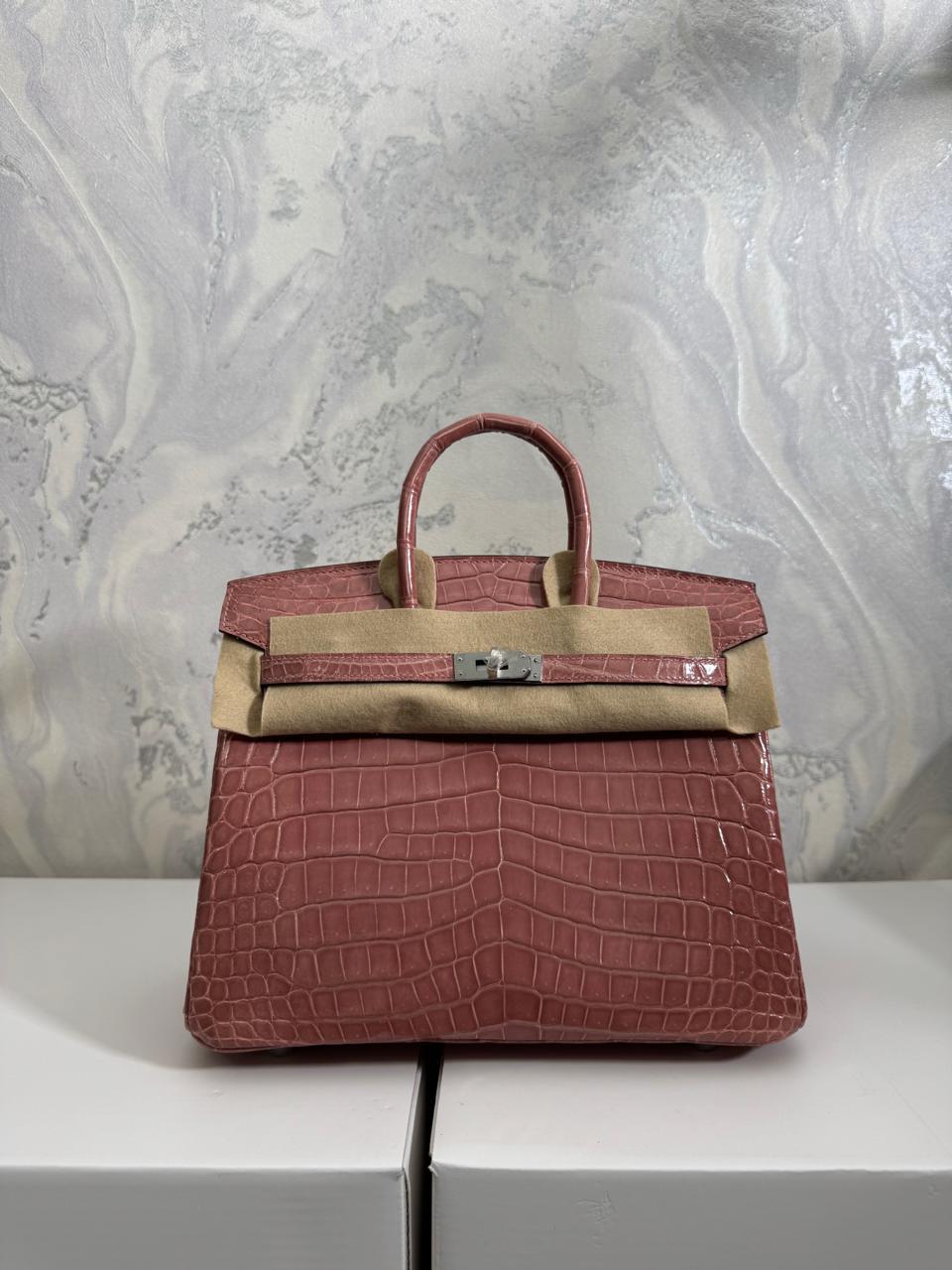 Herm**s crocodile bags.