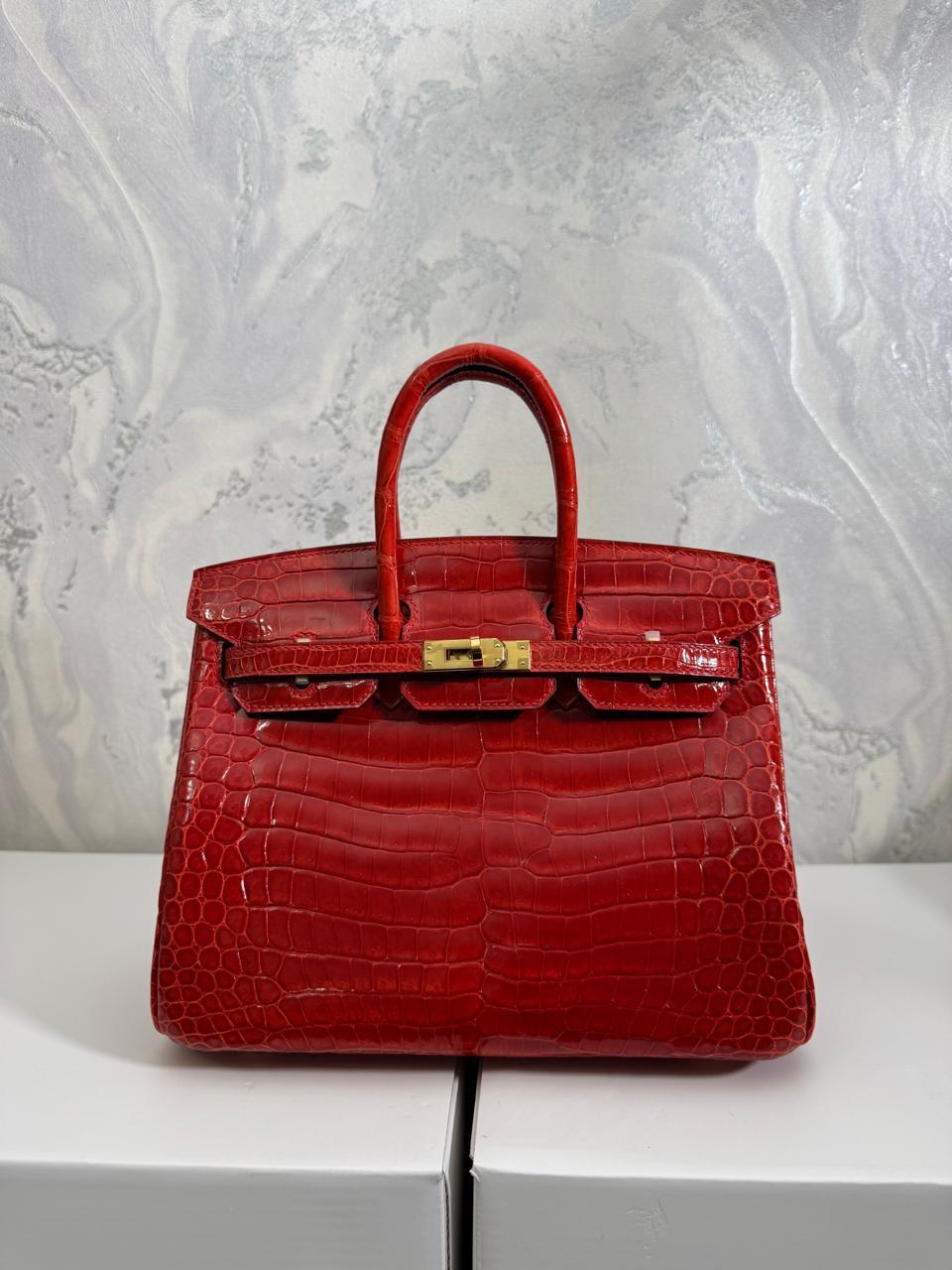 Herm**s crocodile bags.
