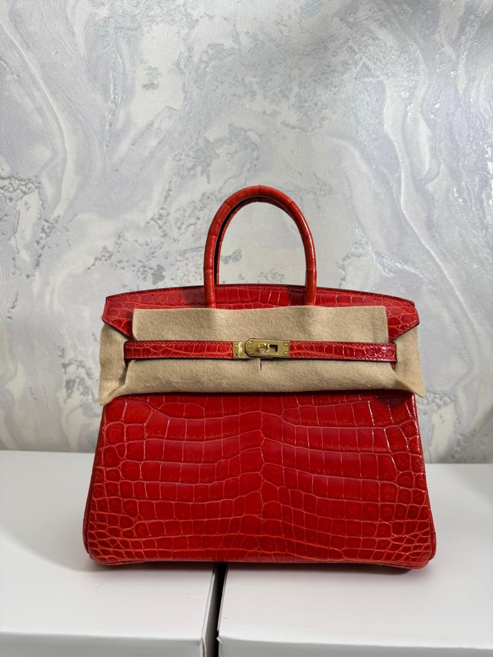 Herm**s crocodile bags.