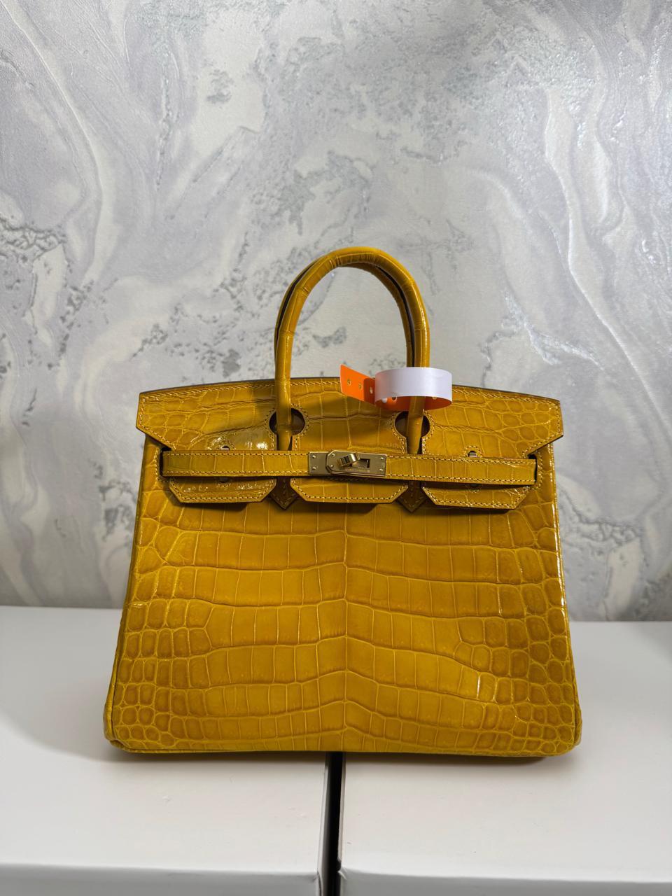 Herm**s crocodile bags.