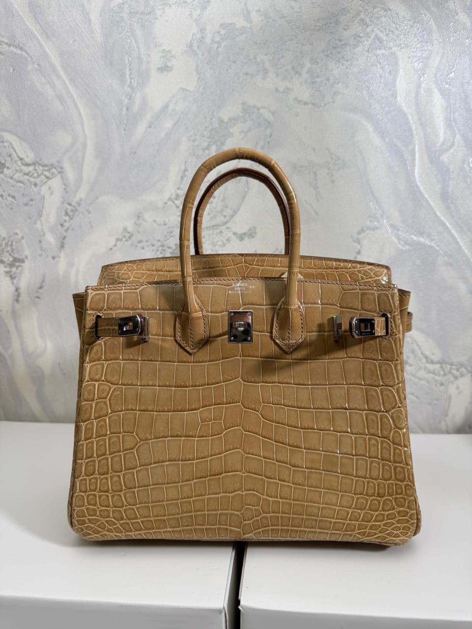 Herm**s crocodile bags.