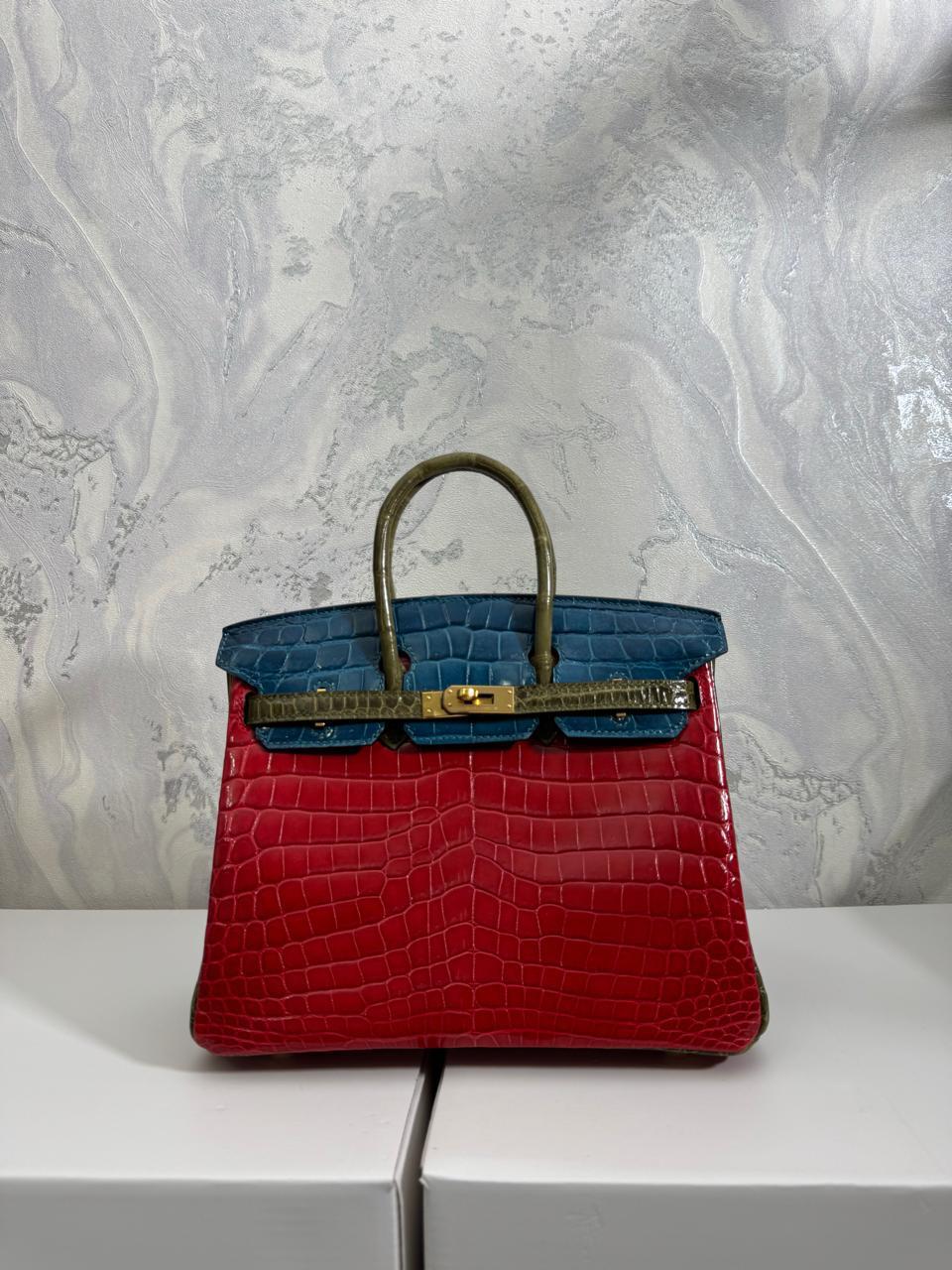 Herm**s crocodile bags.