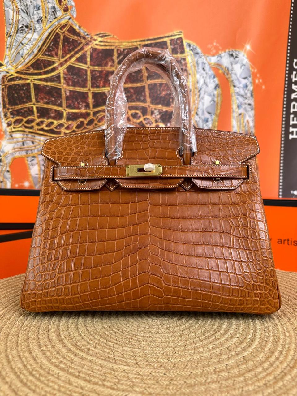 Herm**s crocodile bags.