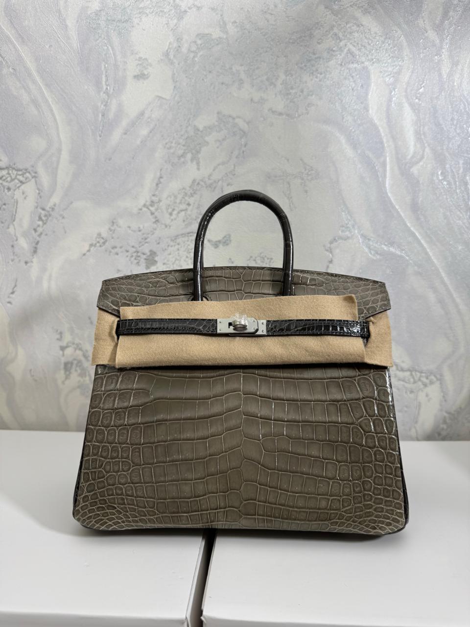 Herm**s crocodile bags.