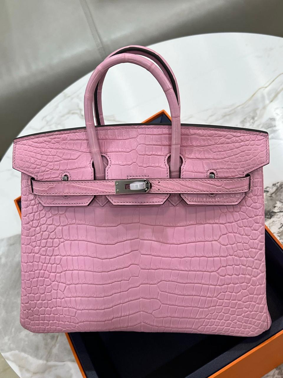Herm**s crocodile bags.