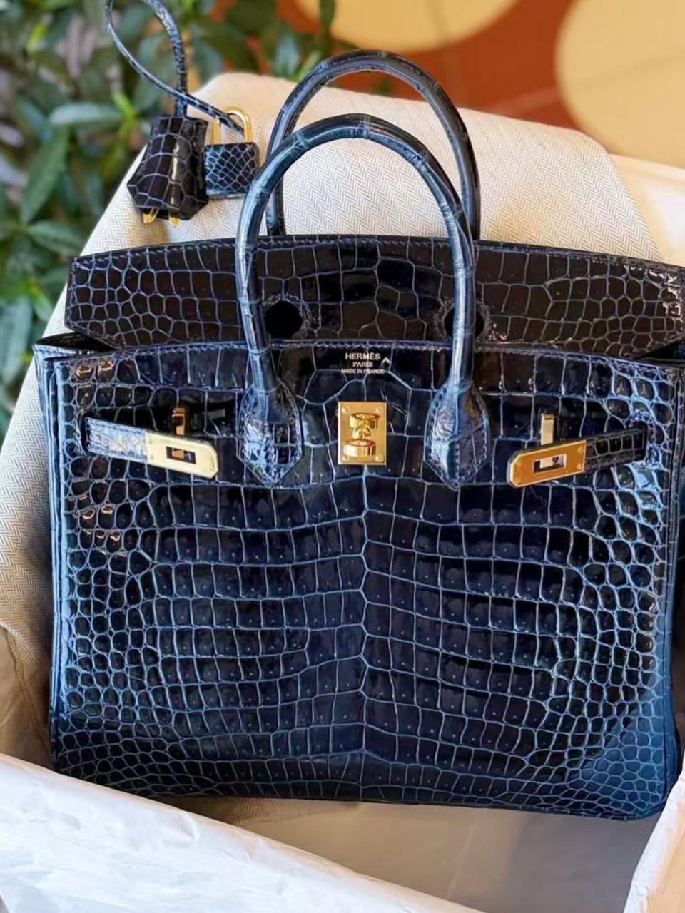 Herm**s crocodile bags.