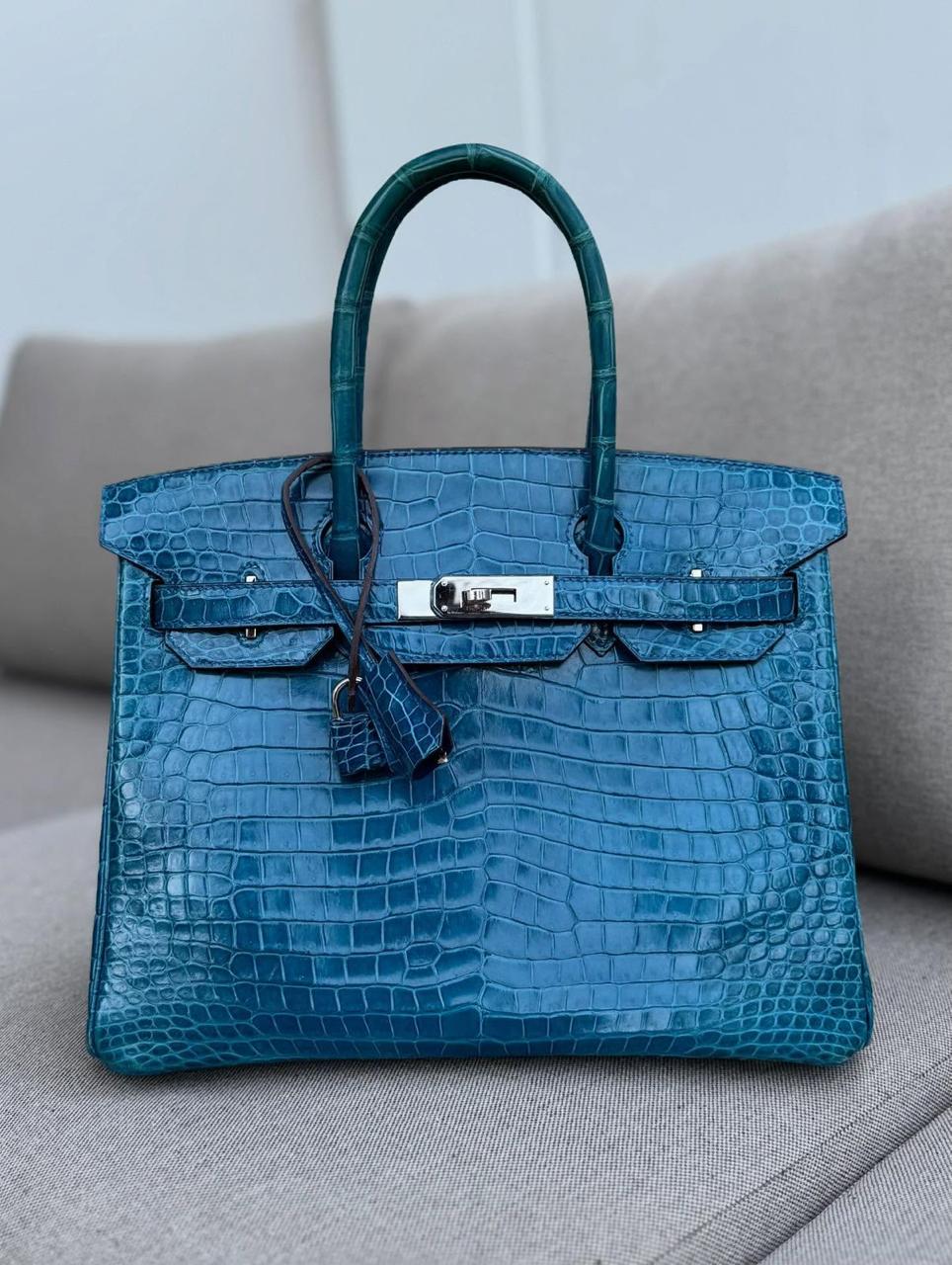 Herm**s crocodile bags.