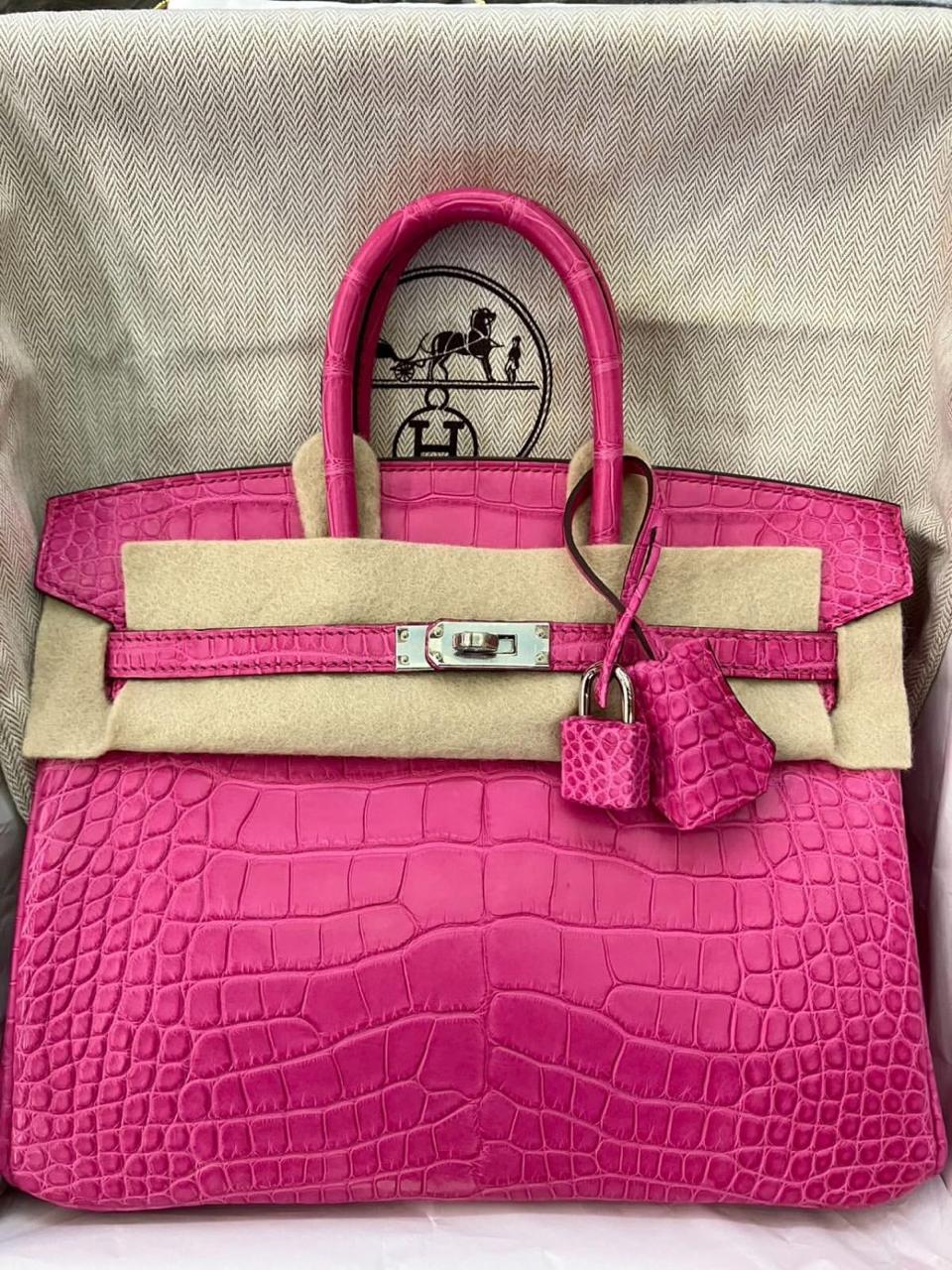 Herm**s crocodile bags.