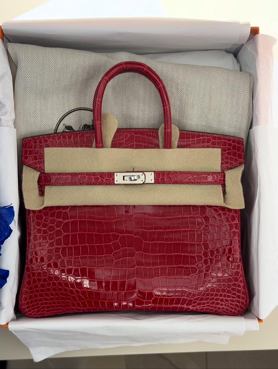 Herm**s crocodile bags.