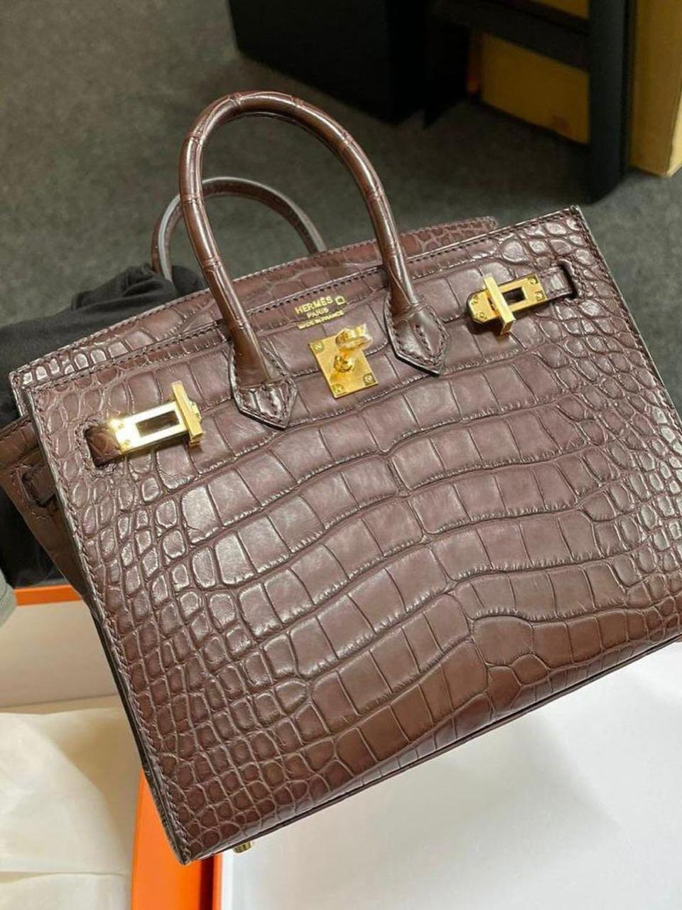 Herm**s crocodile bags.
