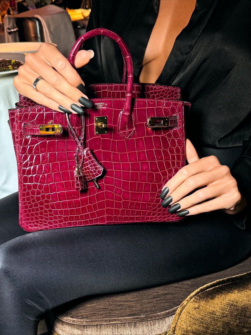 Herm**s crocodile bags.