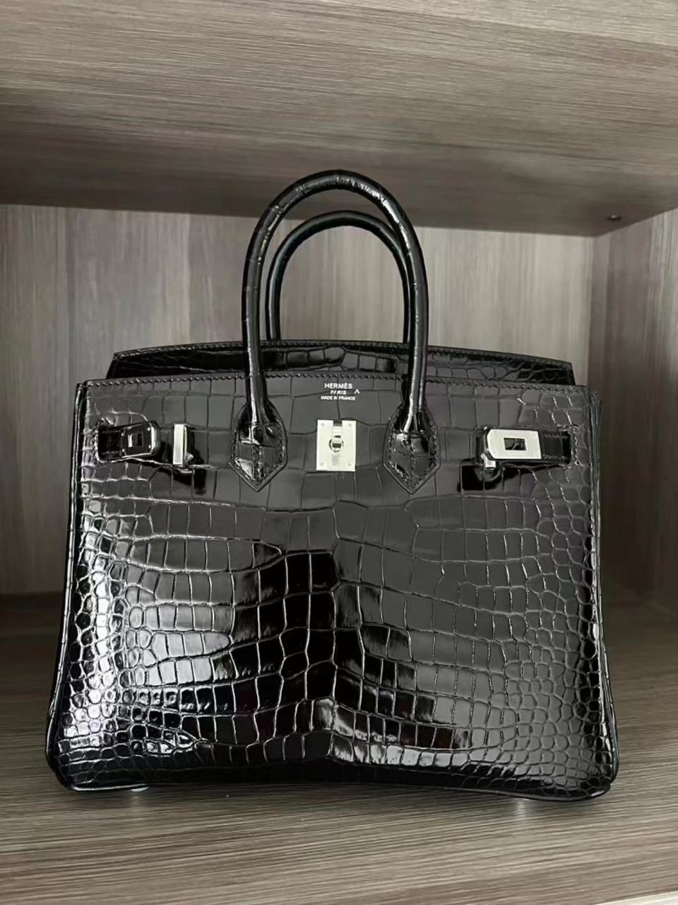 Herm**s crocodile bags.