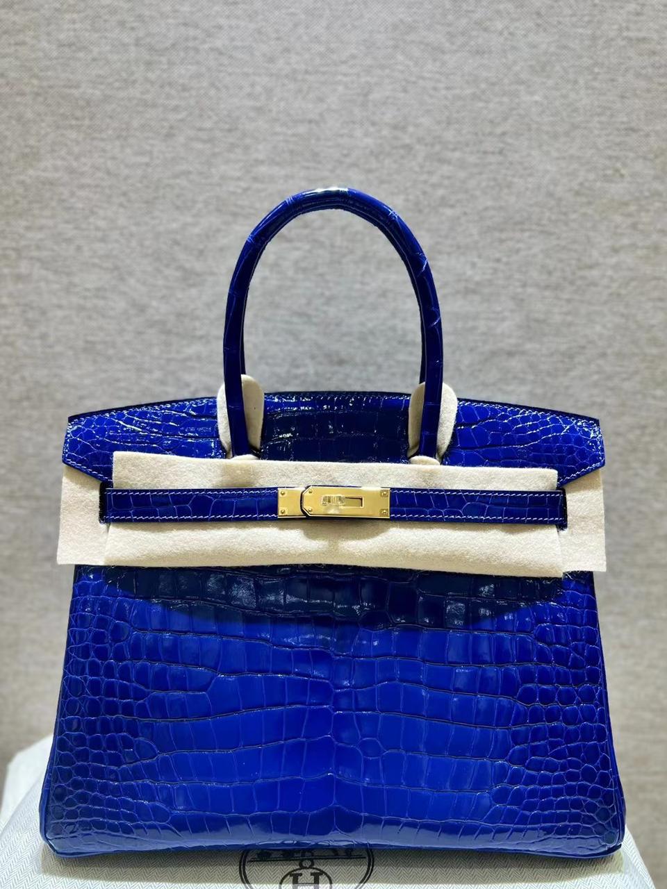 Herm**s crocodile bags.