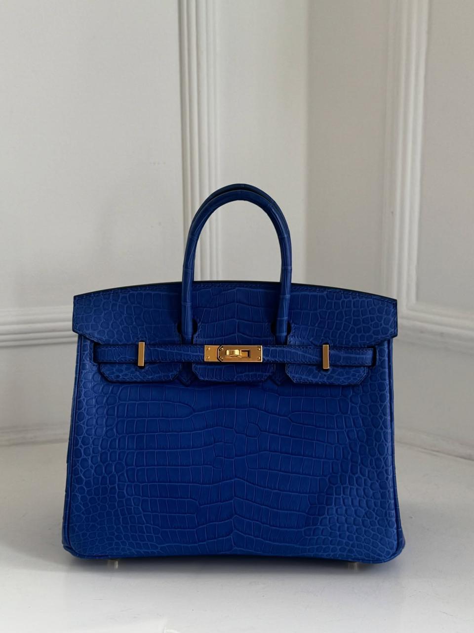 Herm**s crocodile bags.
