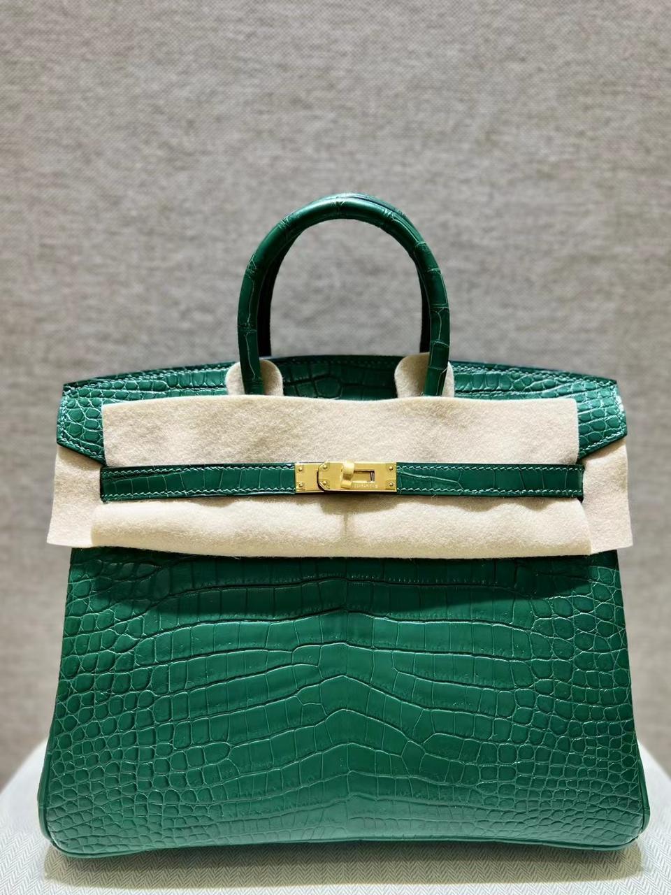 Herm**s crocodile bags.
