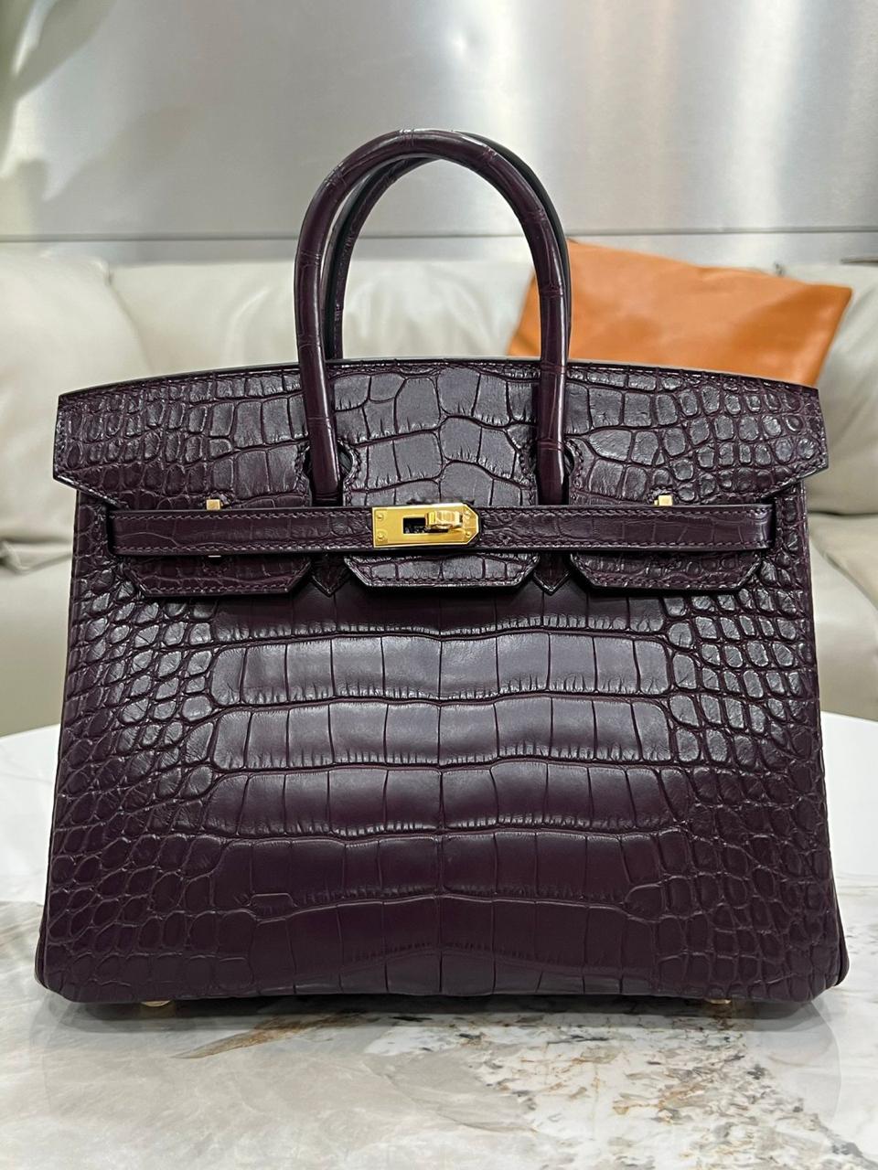 Herm**s crocodile bags.