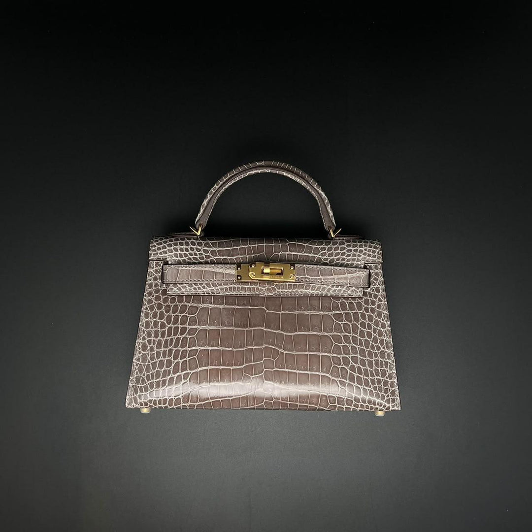 Herm**s crocodile bags.