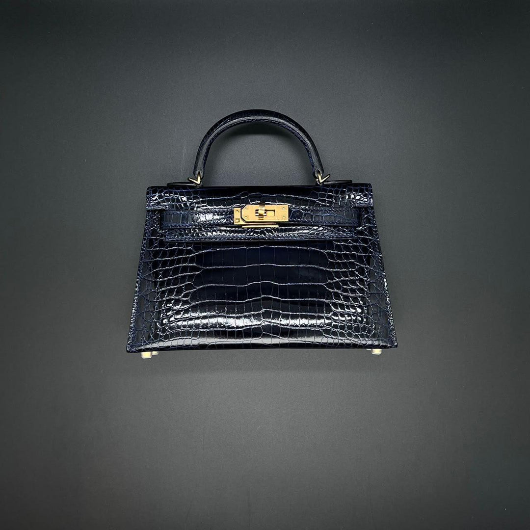 Herm**s crocodile bags.