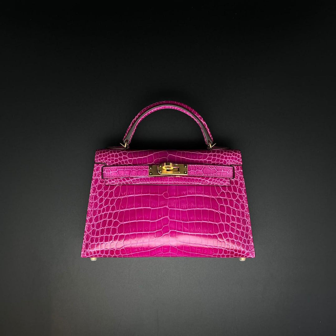 Herm**s crocodile bags.