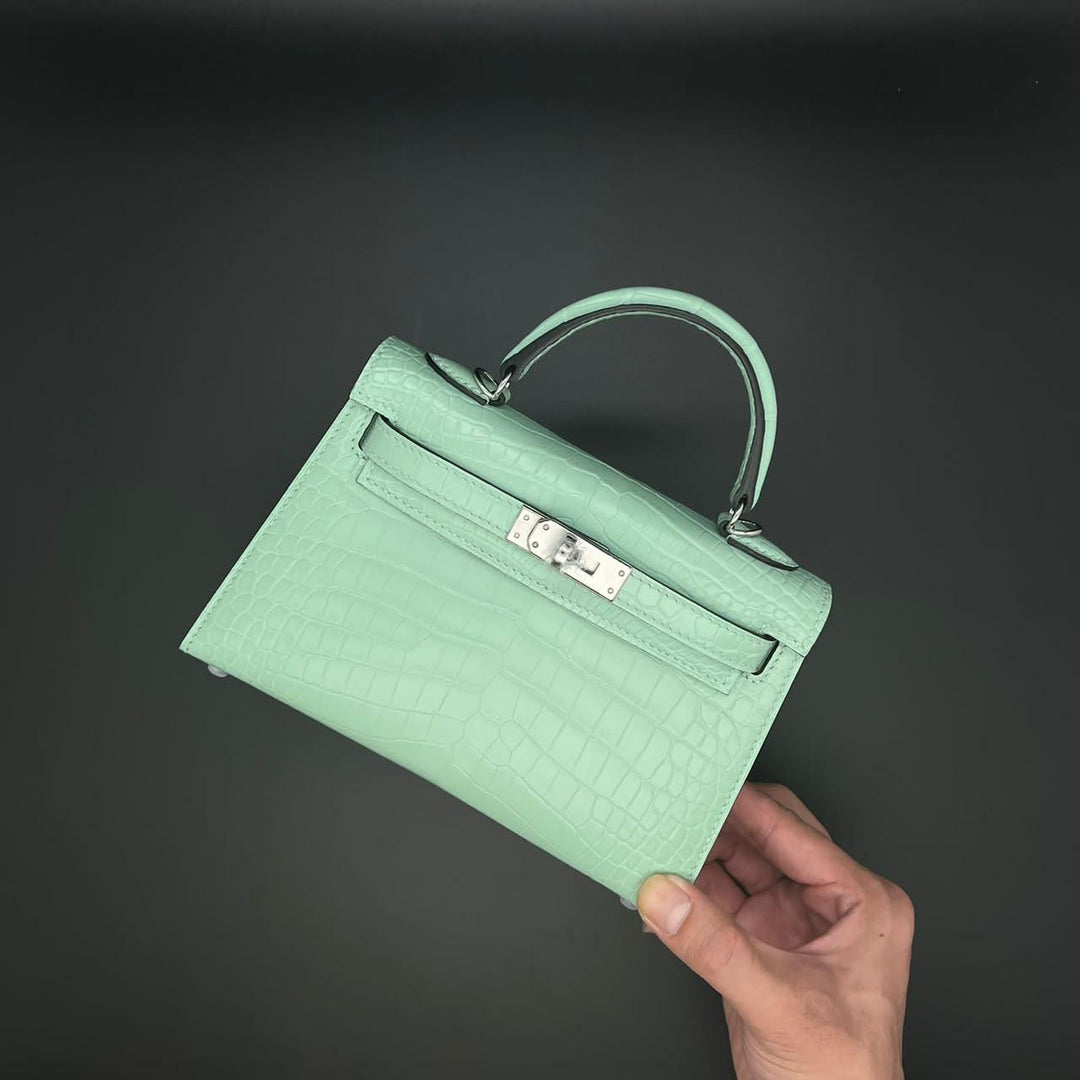 Herm**s crocodile bags.