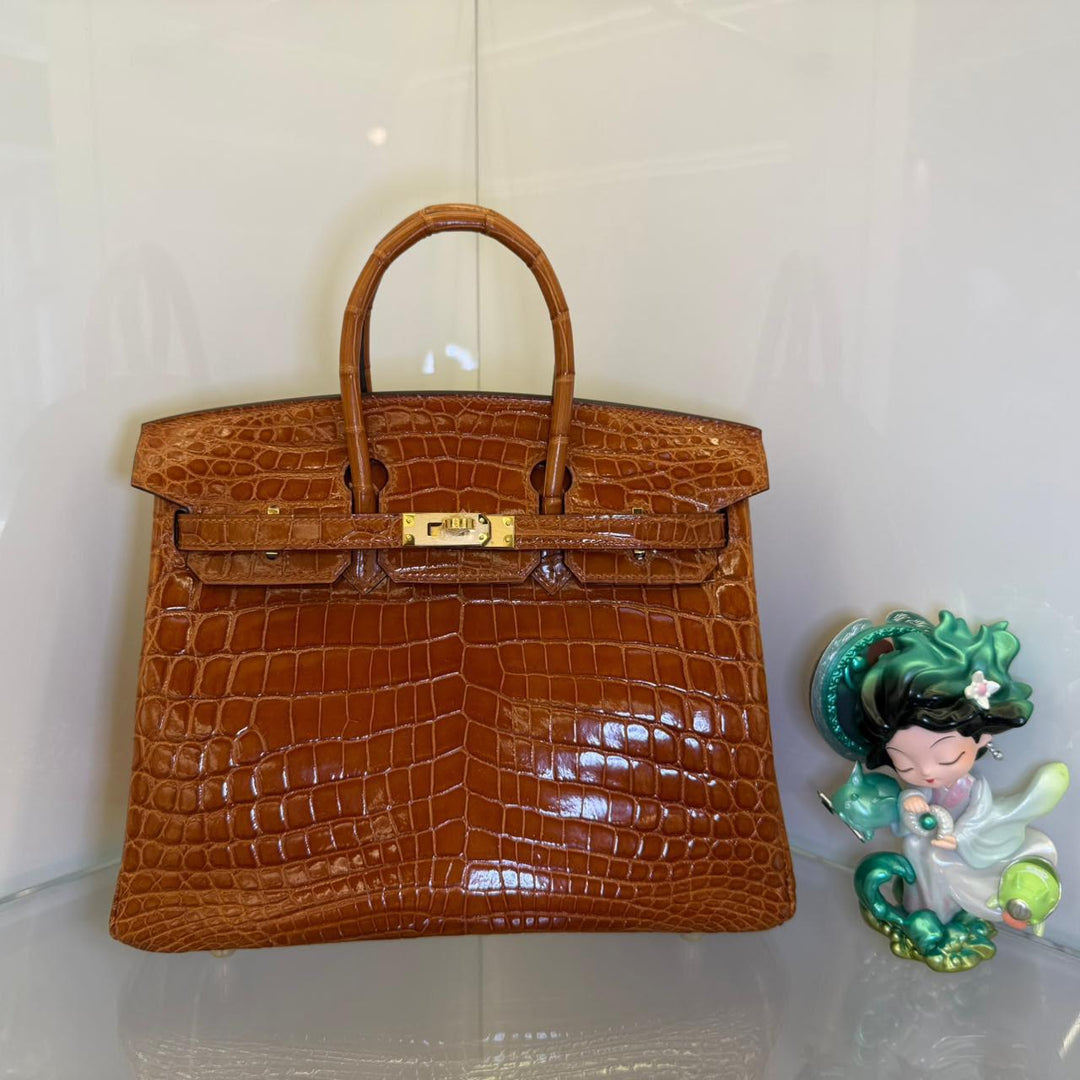 Herm**s crocodile bags.