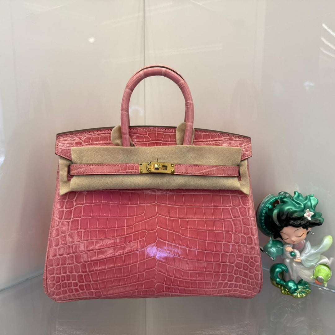 Herm**s crocodile bags.