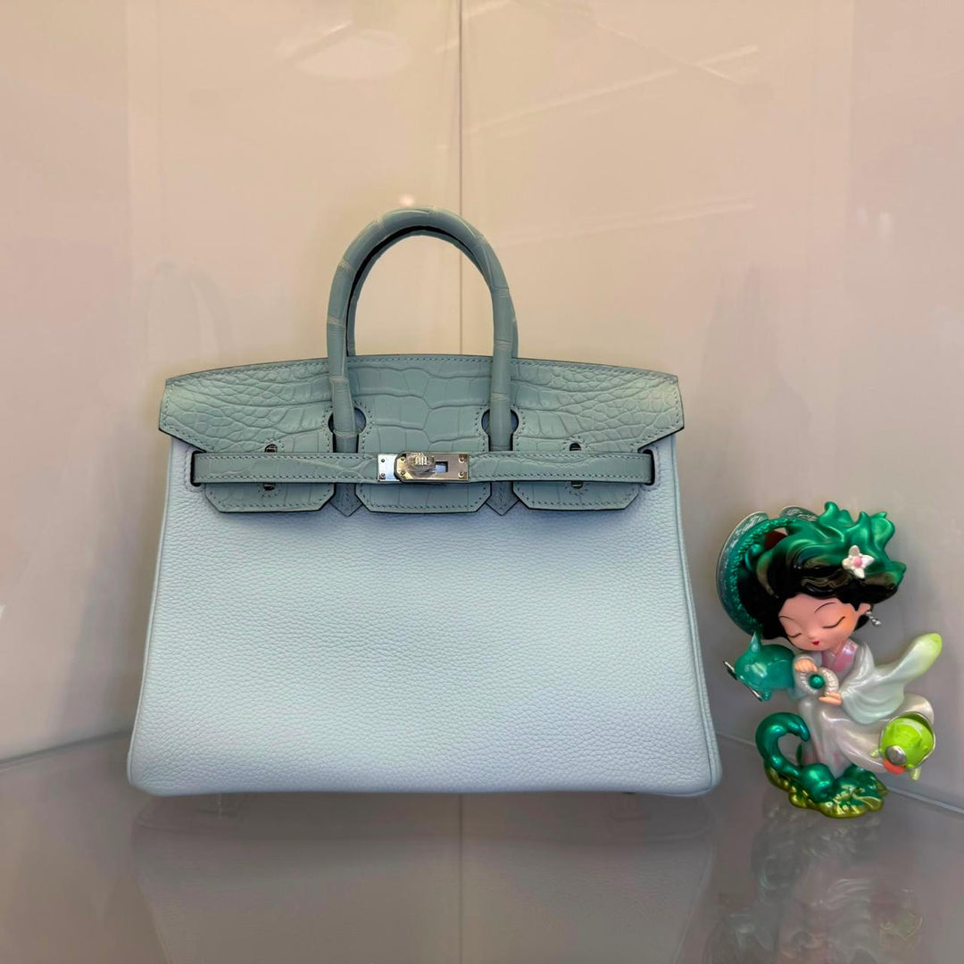 Herm**s crocodile bags.