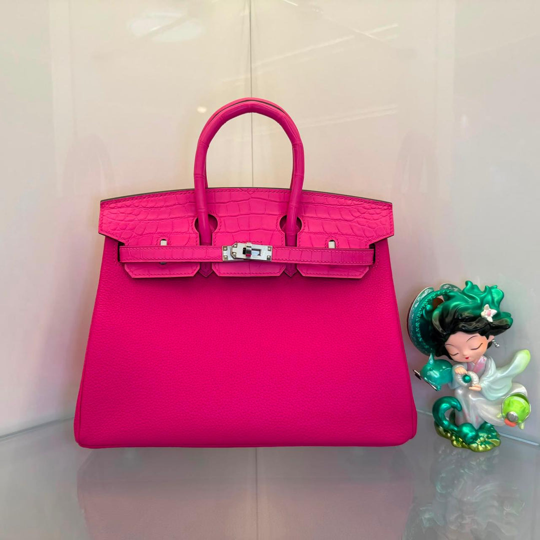 Herm**s crocodile bags.