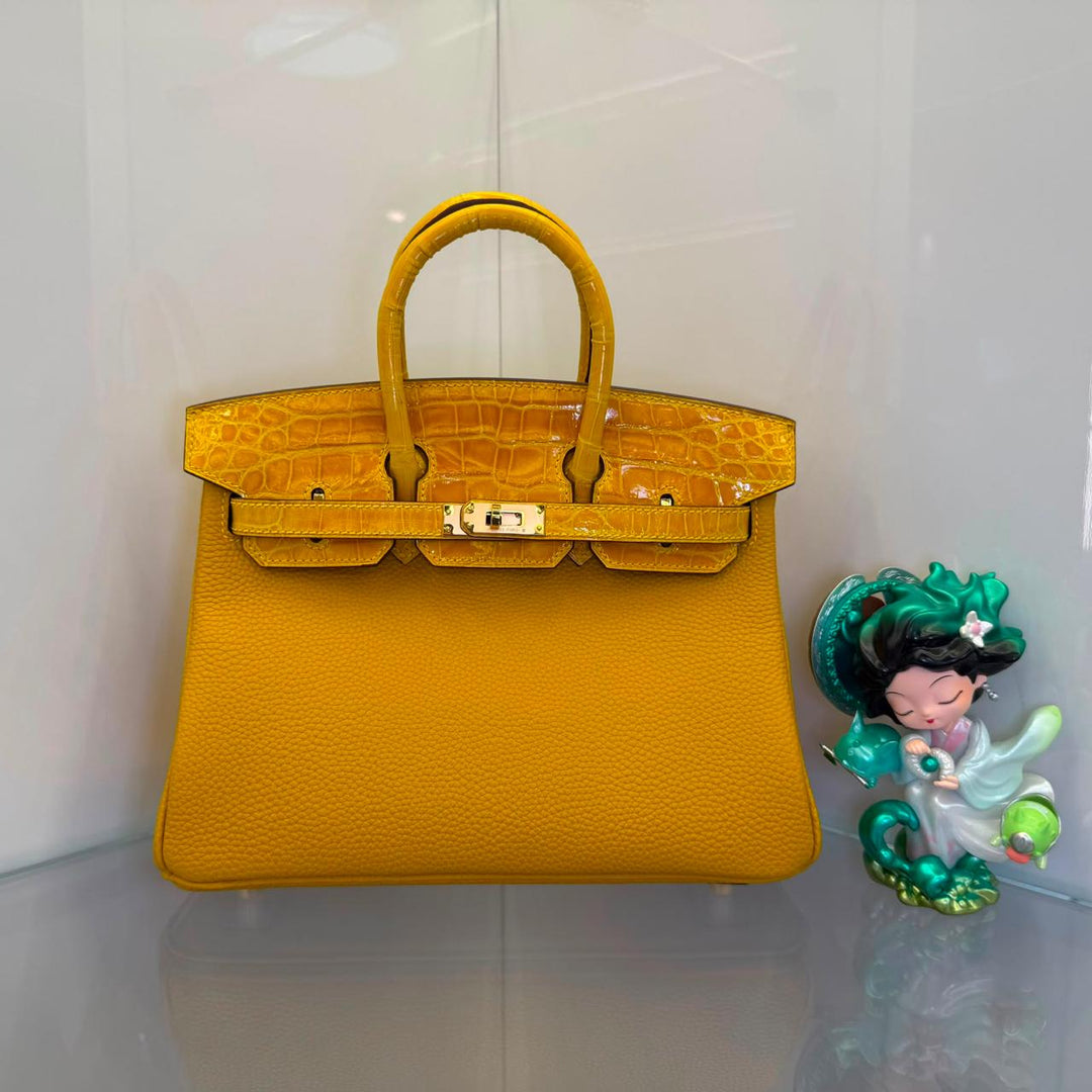 Herm**s crocodile bags.