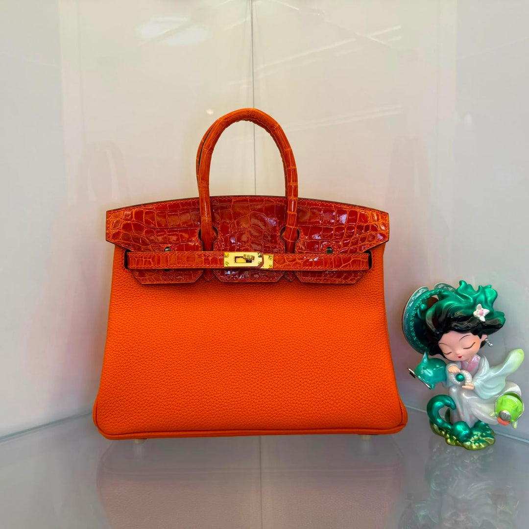 Herm**s crocodile bags.