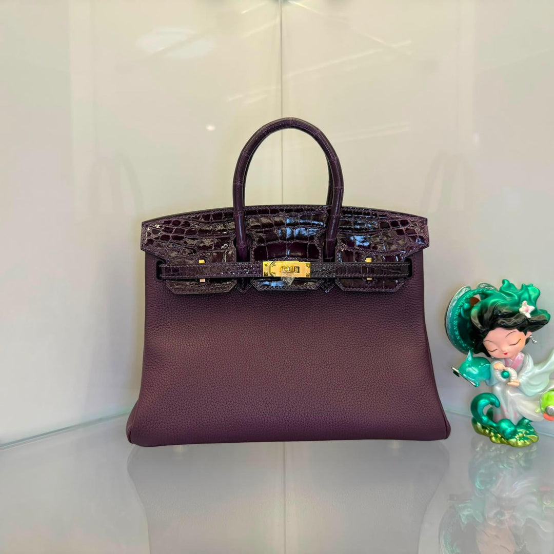 Herm**s crocodile bags.