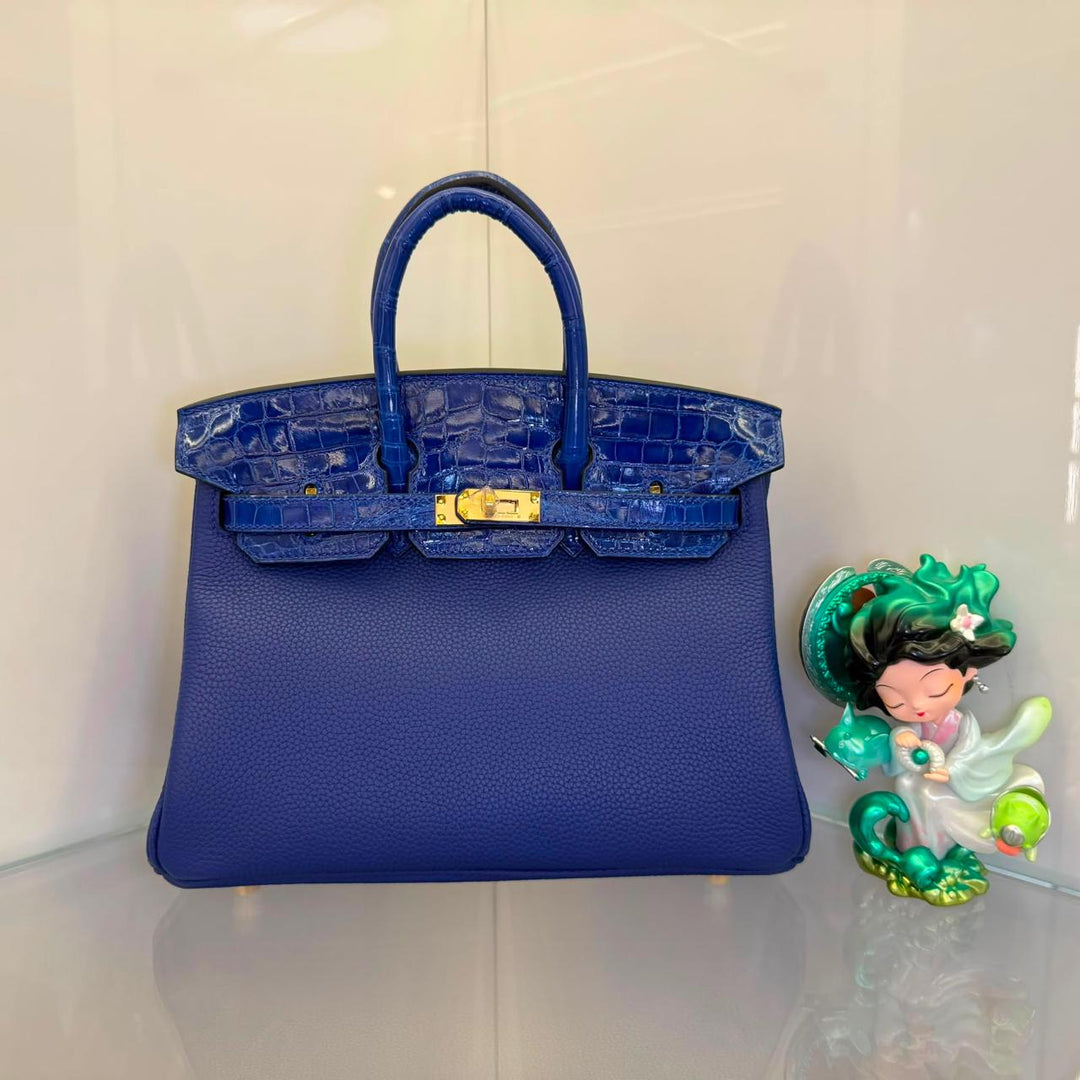 Herm**s crocodile bags.
