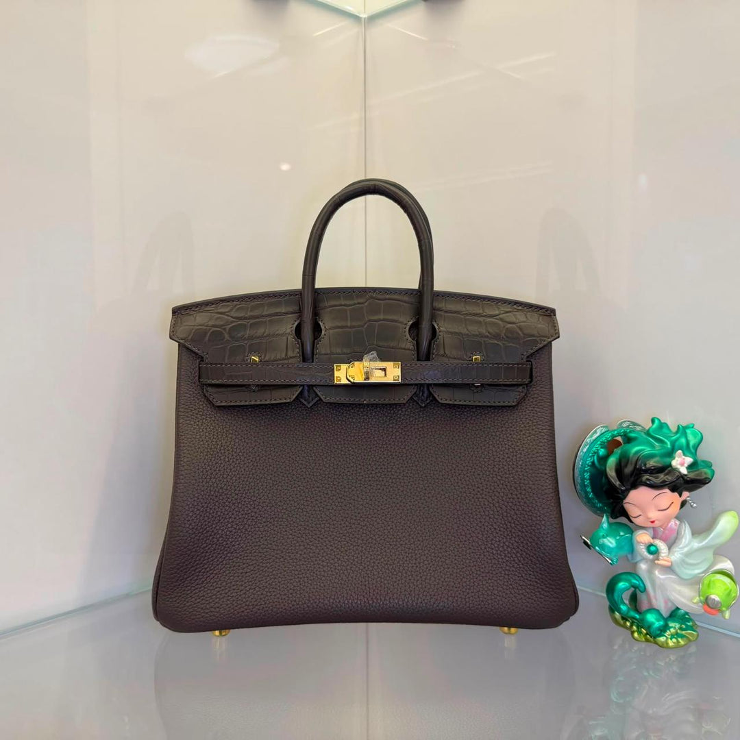 Herm**s crocodile bags.