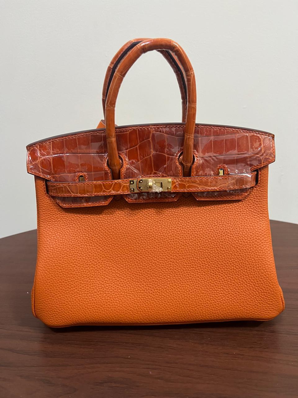 Herm**s crocodile bags.