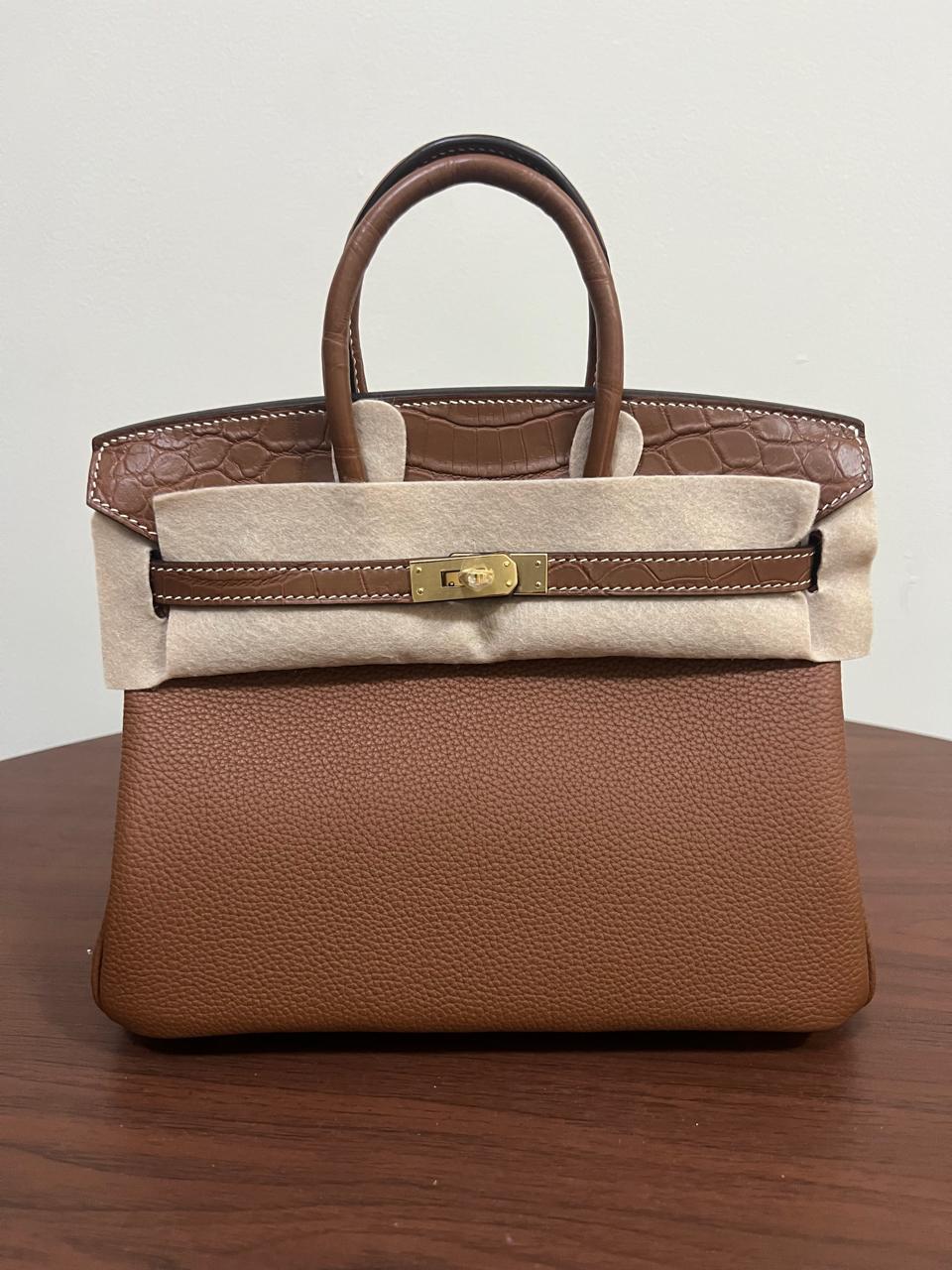 Herm**s crocodile bags.