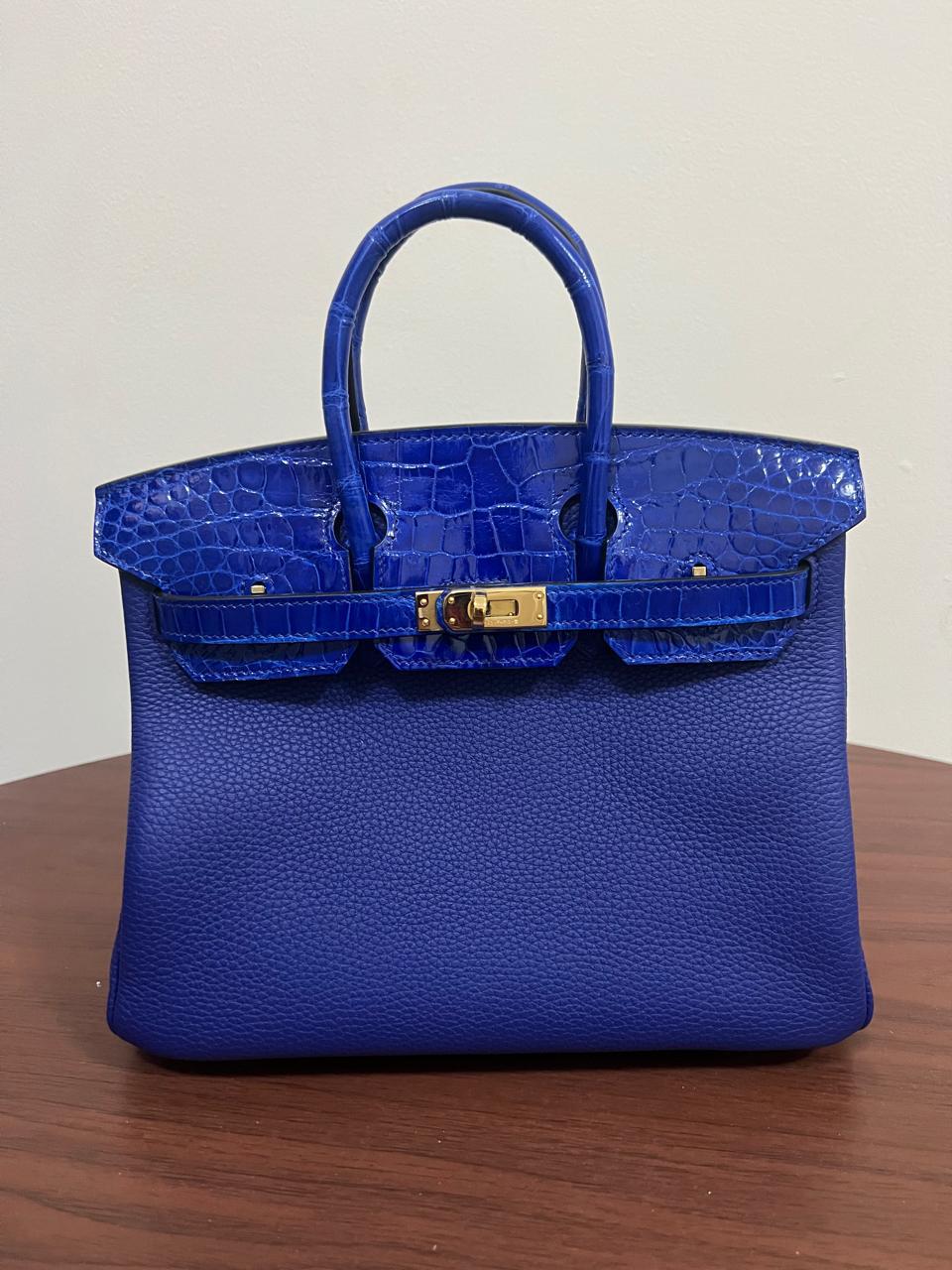 Herm**s crocodile bags.