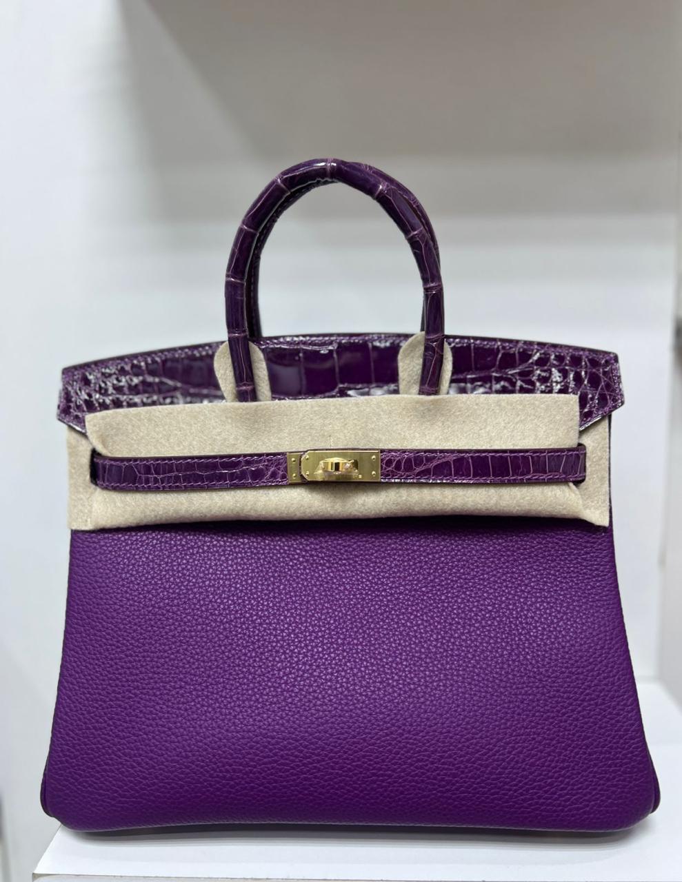 Herm**s crocodile bags.